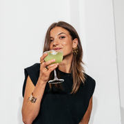Mocktail glass filled with the Basil Breeze mocktail.