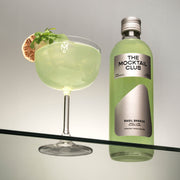 Small bottle of 49 cl Basil Breeze and The Mocktail Club glass filled with this mocktail