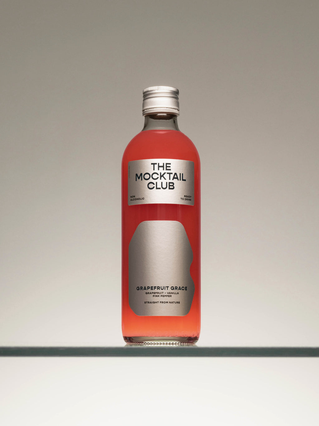 Bottle filled with Grapefruit Grace mocktail 49cl