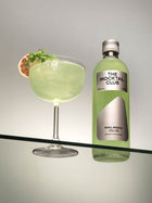 Small bottle of 49 cl Basil Breeze and The Mocktail Club glass filled with this mocktail