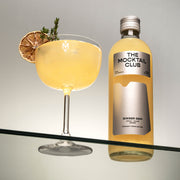 Small bottle of 49 cl Ginger Gem and The Mocktail Club glass filled with this mocktail