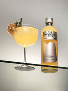 Small bottle of 49 cl Ginger Gem and The Mocktail Club glass filled with this mocktail